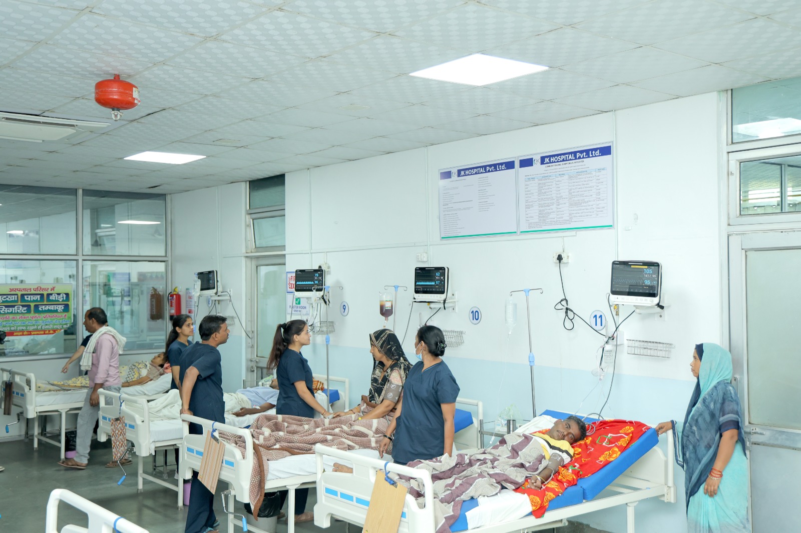 Medical staff attending to patients in the ward.